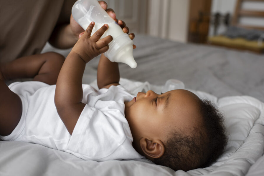 side-view-parent-feeding-baby (1)