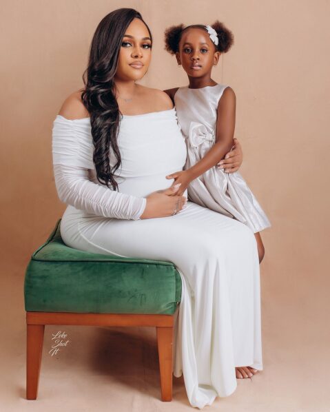 Tina Omotayo and child in white outfit