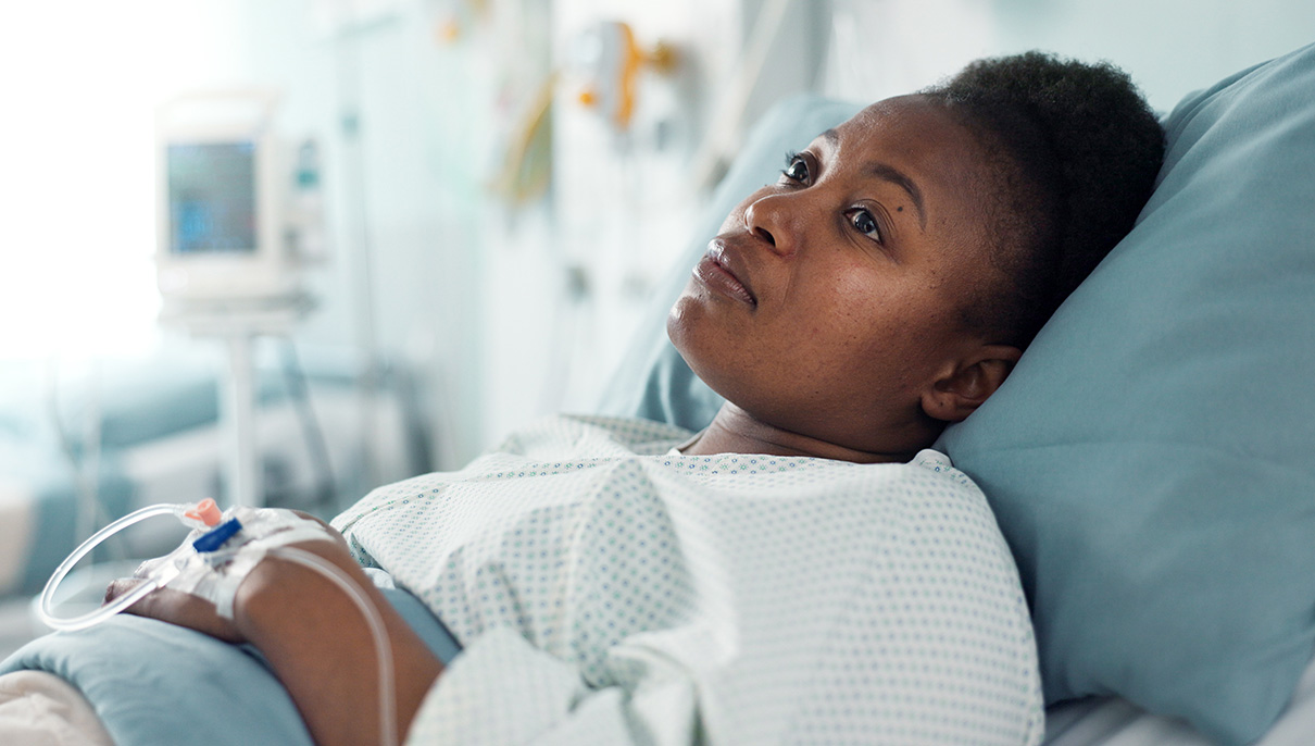 Sad, sick and a thinking black woman in a hospital bed for healthcare, exam and a surgery. Tired, depression and an African clinic patient in a ward for treatment help, mental health or a virus