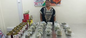 NDLEA suspect with tins