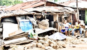 People-sitting-in-front-of-their-house-in-Jabi-Abuja