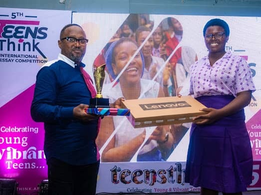 Chairman of Kehinde Olesin Foundation, Mr Babajide Olesin, presenting the third prize to the winner, Oghenerugba Akpabor‑Okoro, of Babington Macaulay Junior Seminary, Ikorodu, Lagos State