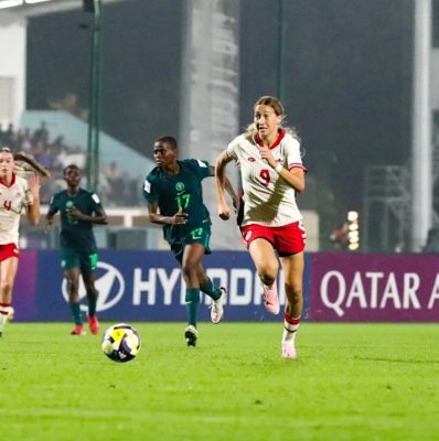 The image shows a match between the Nigeria and Canada U-17 women’s national football teams during the FIFA U-17 Women’s World Cup.