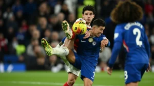 Arsenal’s English midfielder #41 Declan Rice vies with Chelsea’s Argentinian midfielder #08 Enzo Fernandez
