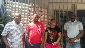 Officials of the firm with gift items