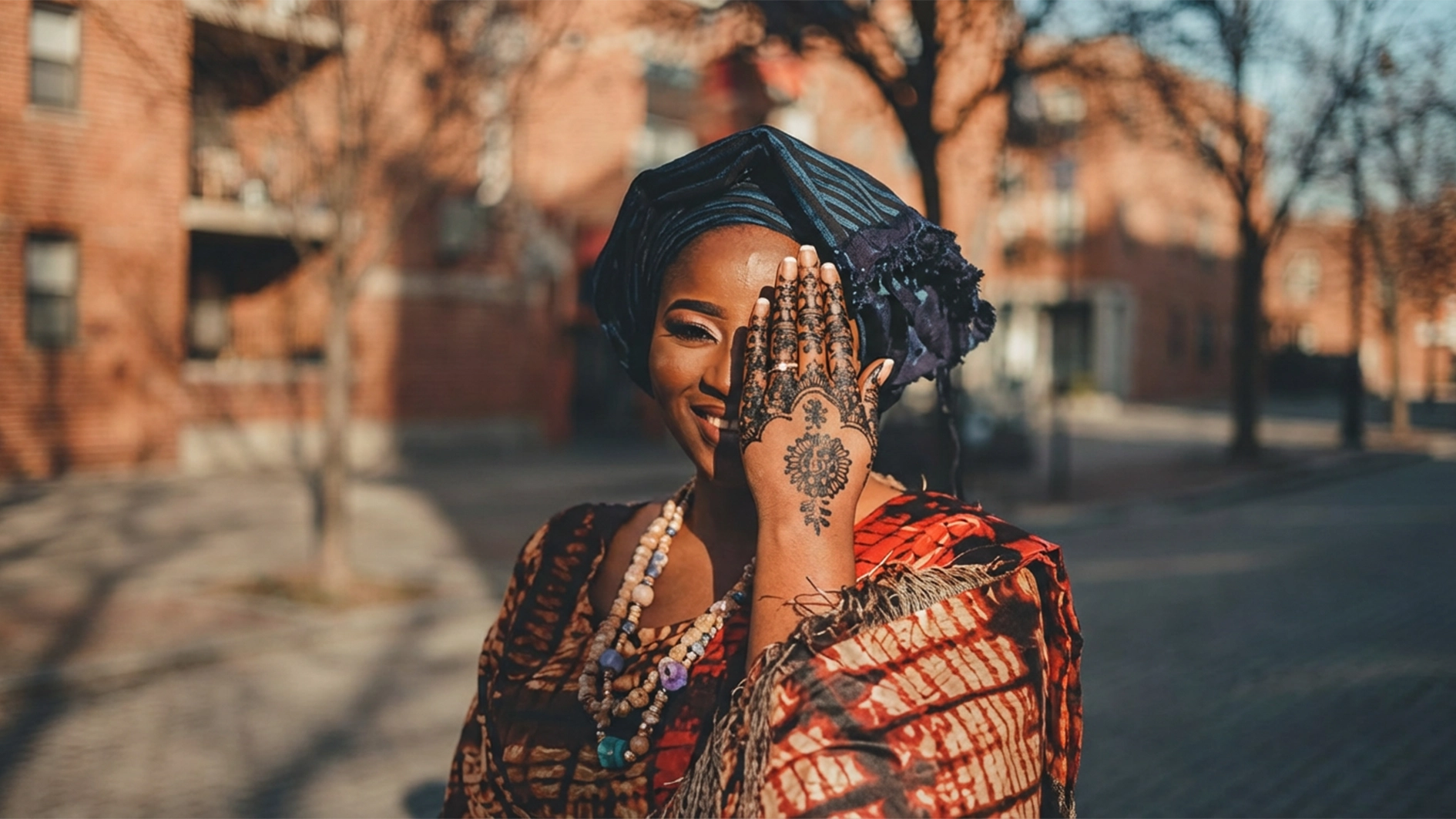 A beautiful african woman showcasing her black coloured henna