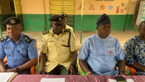 Acting TRACE Commander, Omonayajo flanked by the Special Adviser to the Governor on Security matters, AIG Shola Subair (retd) at the event.