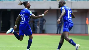 Austine Ojejepha (left) celebrates with a team mate