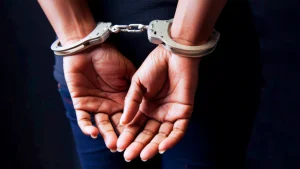 Black woman in handcuffs