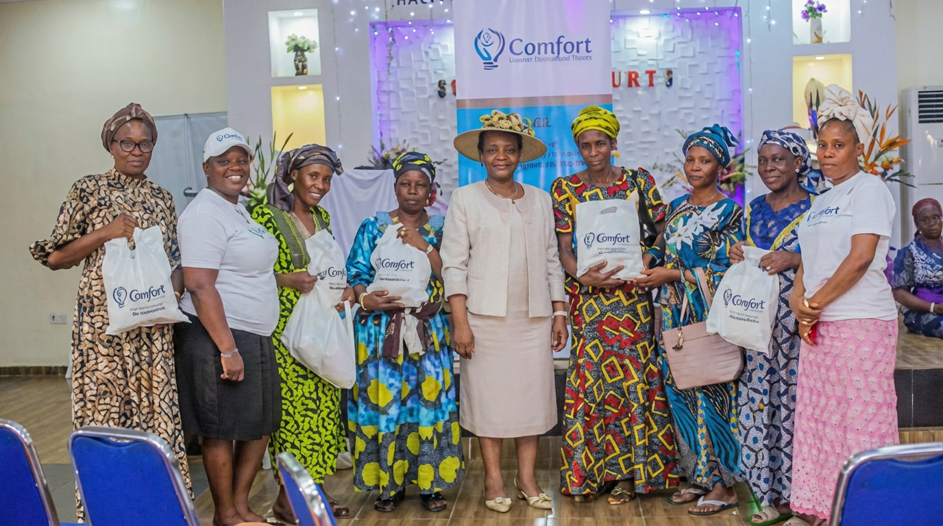 Chairman, Comfort in Light Foundation, Mrs Kikelomo Ifekoya (centre), flanked by some beneficiaries in Lagos.