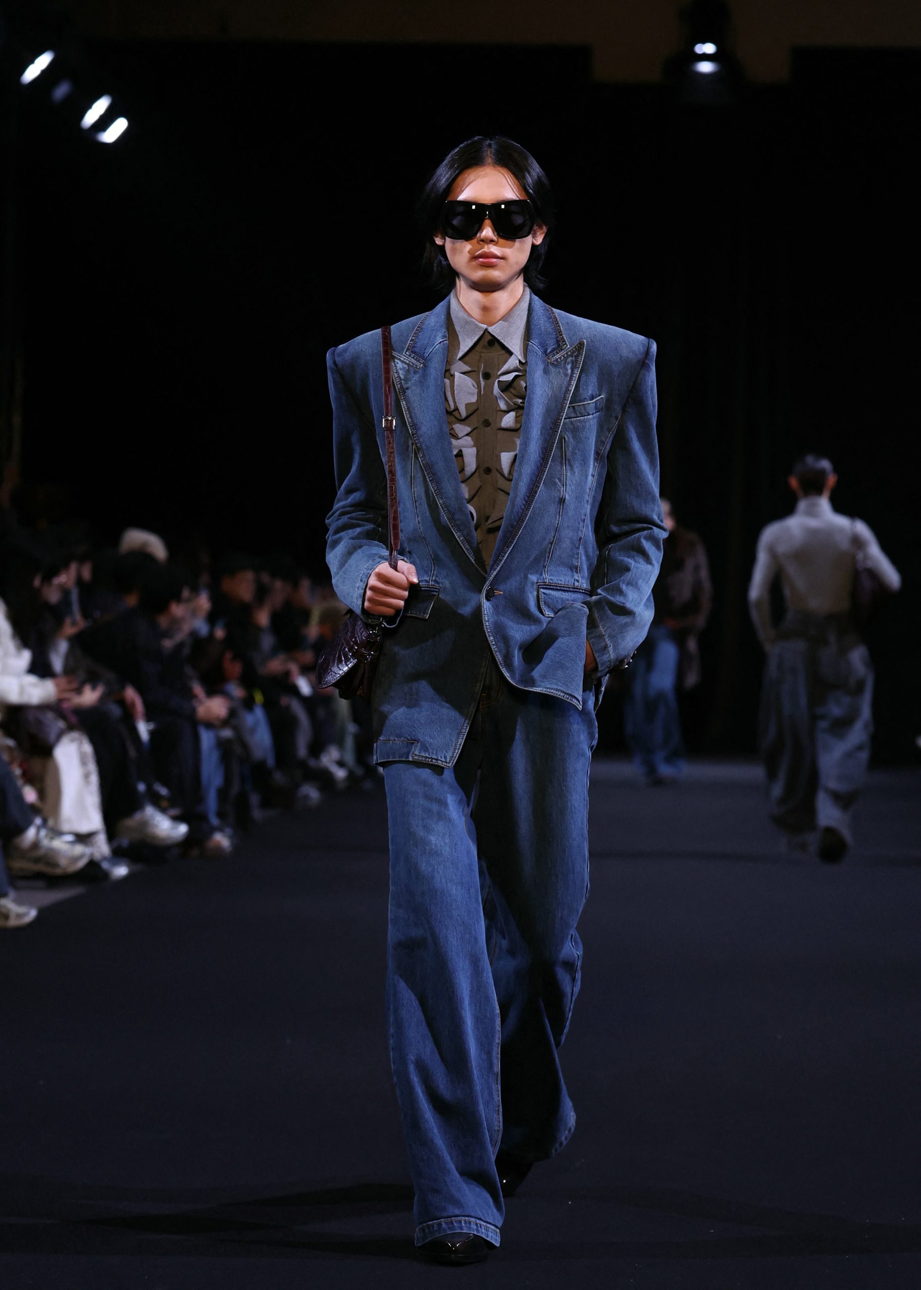 A model presents a creation by Juun.J for the Menswear Ready-to-wear Fall-Winter 2026/2027 collection as part of the Men Paris Fashion Week in Paris on January 23, 2026. (Photo by ALAIN JOCARD / AFP)