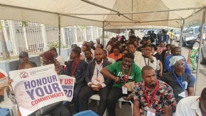 Local contractors on a protest, blocking the entrance of the Ministry of Finance, demanding payment for executed projects in Abuja, yesterday.