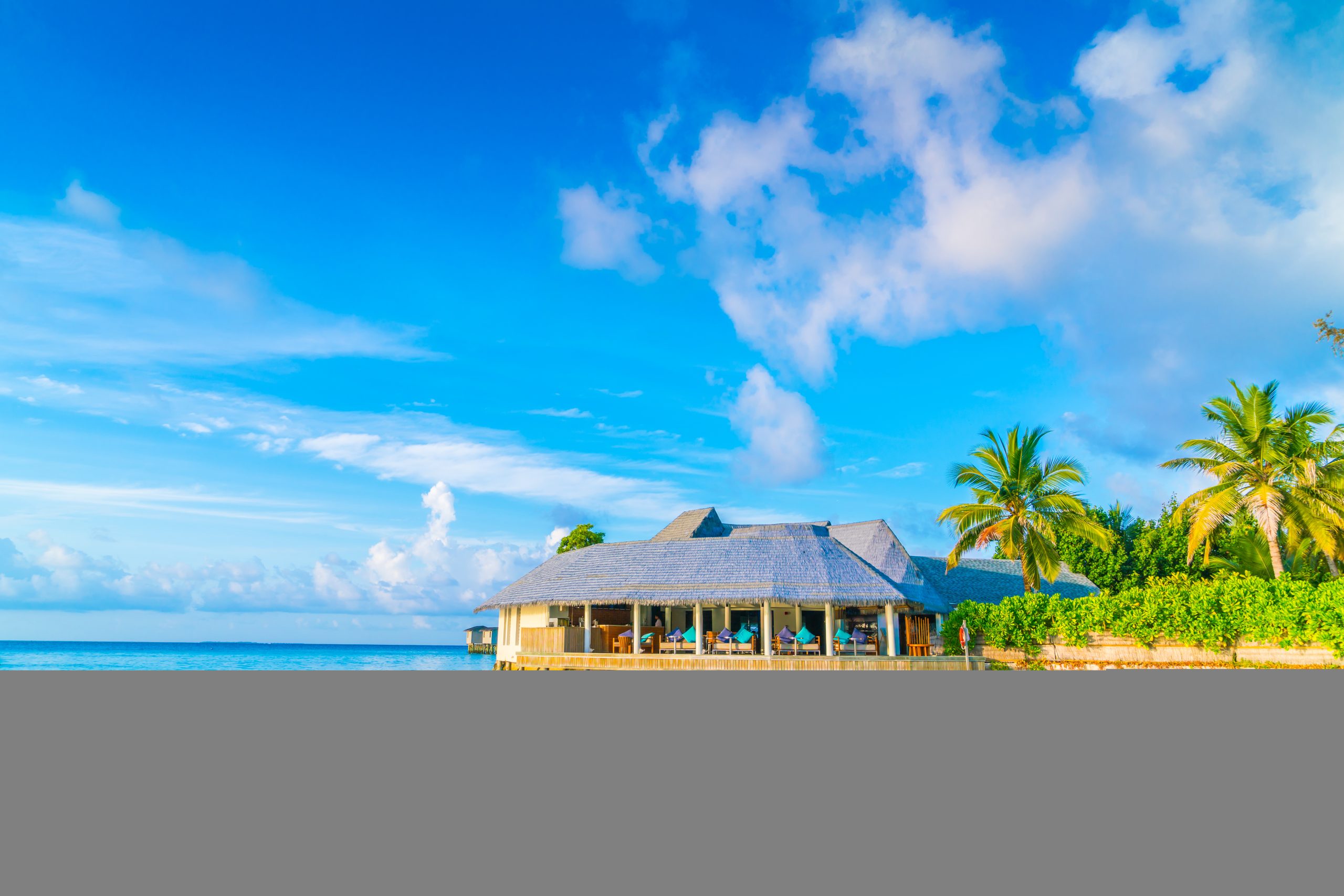 Beautiful water villas in tropical Maldives island at the sunrise time