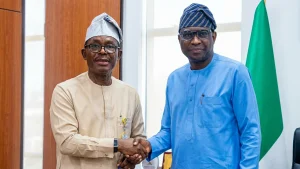 Managing Director, Nigeria Deposit Insurance Corporation (NDIC) Thompson Oludare Sunday (left) and the Chairman of the Economic & Finance Crimes Commission (EFCC) Olanipekun Olukoyede during the NDIC Management