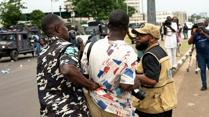 Police-dragging-a-journalist