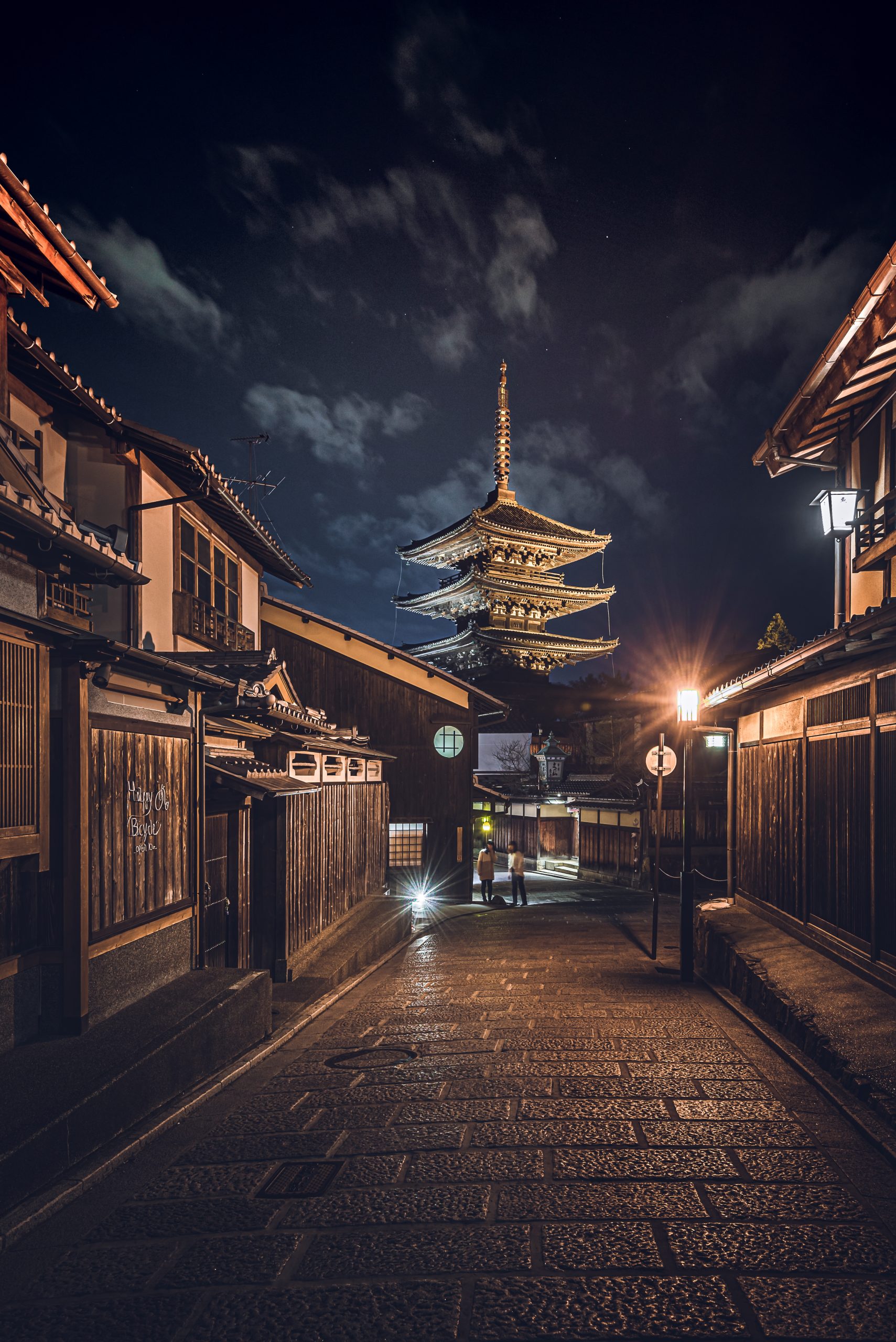 Vertical shot of a road in the middle of buildings in japan