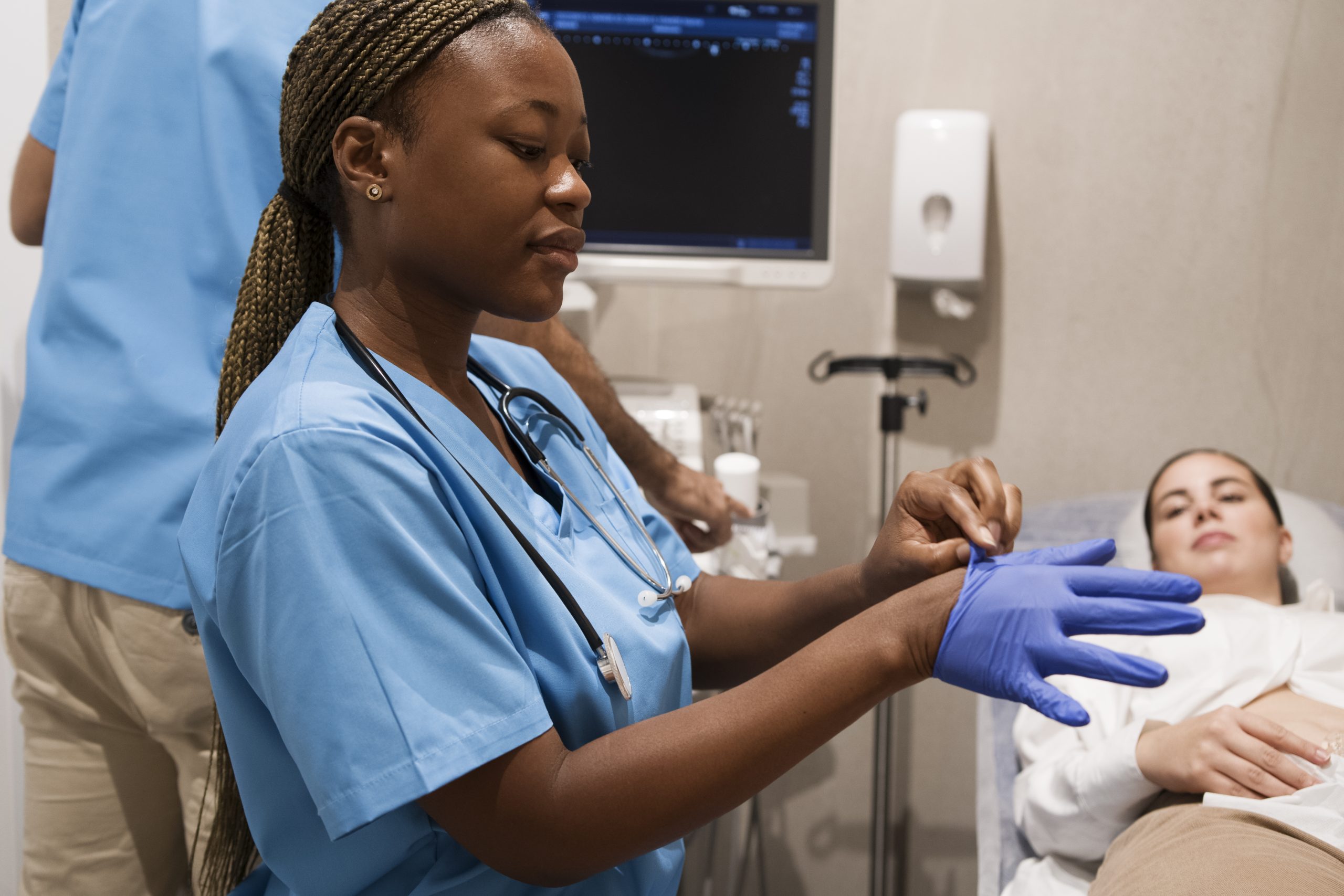nurse-her-work-clinic-wearing-scrubs-gloves,. Photos from Freeepik