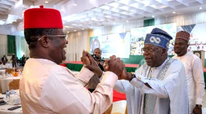The Minister of Works, Sen. David Umahi (L) and President Bola Ahmed Tinubu (R)