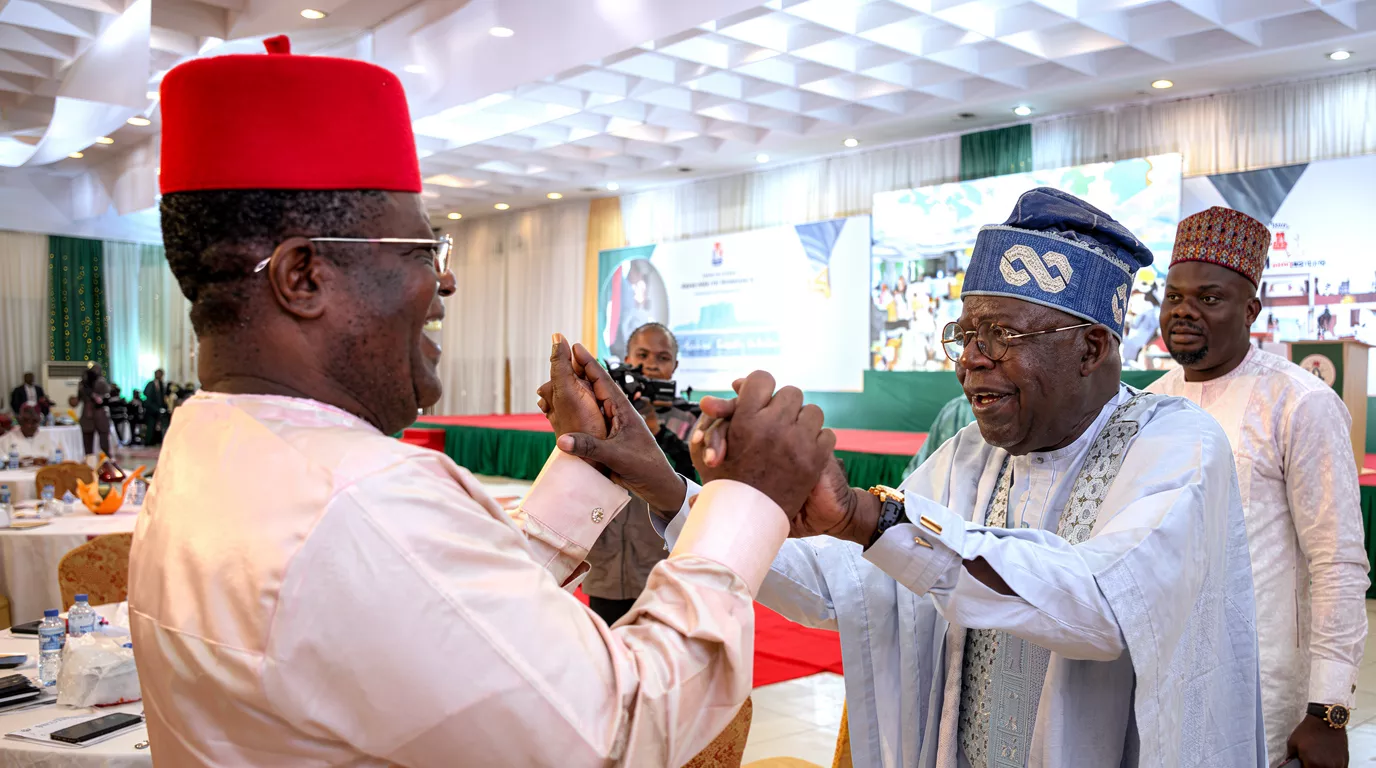 The Minister of Works, Sen. David Umahi (L) and President Bola Ahmed Tinubu (R)