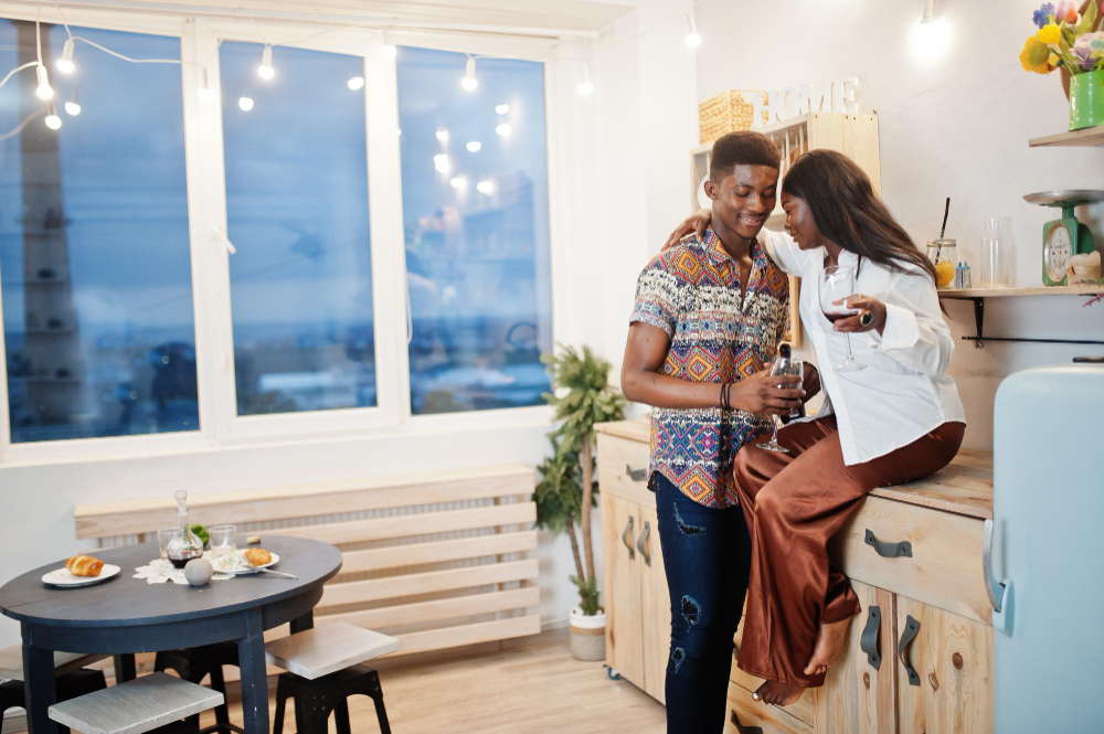 A young couple relaxing inside a modern apartment, reflecting changing housing lifestyles in Lagos.