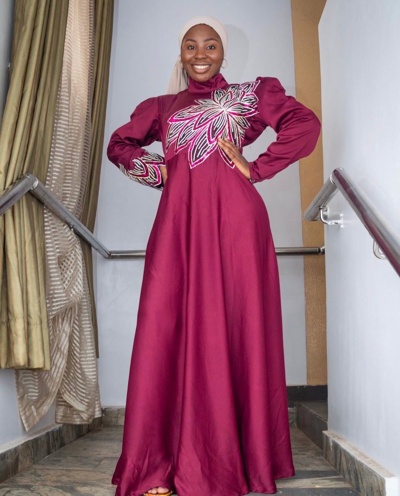 Burgundy gown from House of Anaum's collection by Lateefat Odunuga