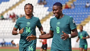 Asisat Oshoala (right) and Oluwatosin Demehin celebrating one of Super Falcons’ goals against Tunisia at the WAFCON in Morocco on Sunday.