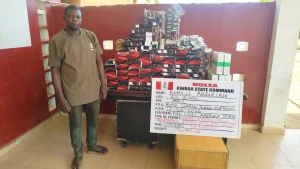 Suspect with seized items (1)