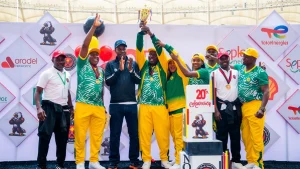 Team PTI athletes and officials celebrate after receiving their trophy as overall winners in the Tennis event at NOGIG 2026