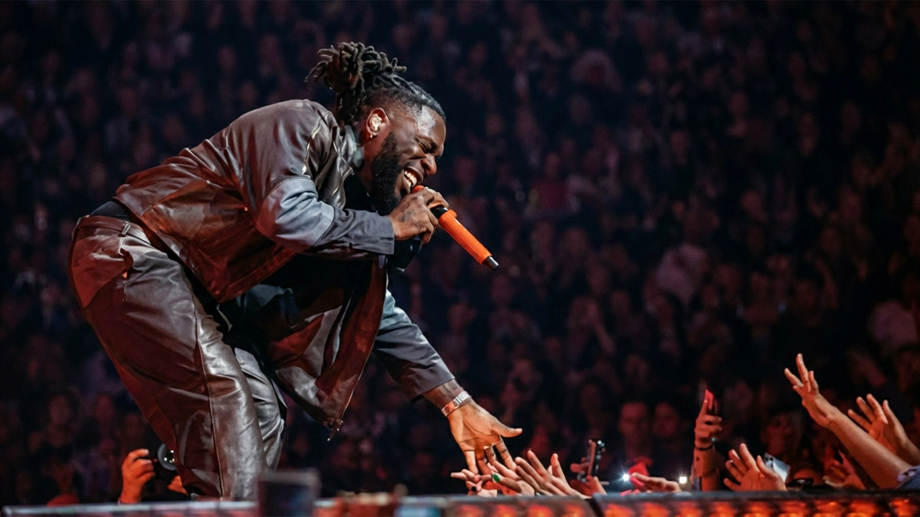 WHERE TO PARTY _ Burna Boy on stage.