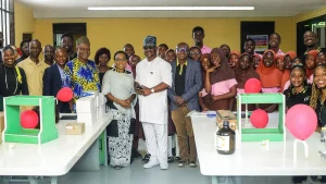 Permanent Secretary, Education District III, Olawale Osinaike (middle) with officials of EY; Principal and some of the students at the inauguration of one of the laboratories at Wahab Folawiyo Senior High School, Ikoyi, Lagos.