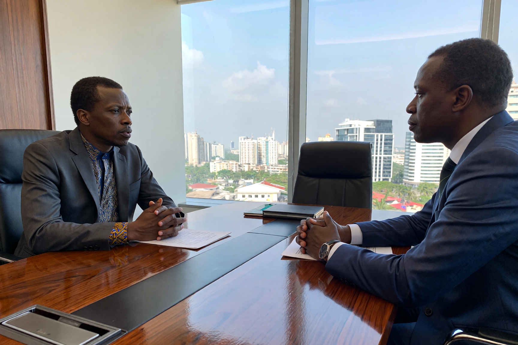 Which country speaks English like Nigeria? African students and professionals speaking fluent English in a modern urban setting
