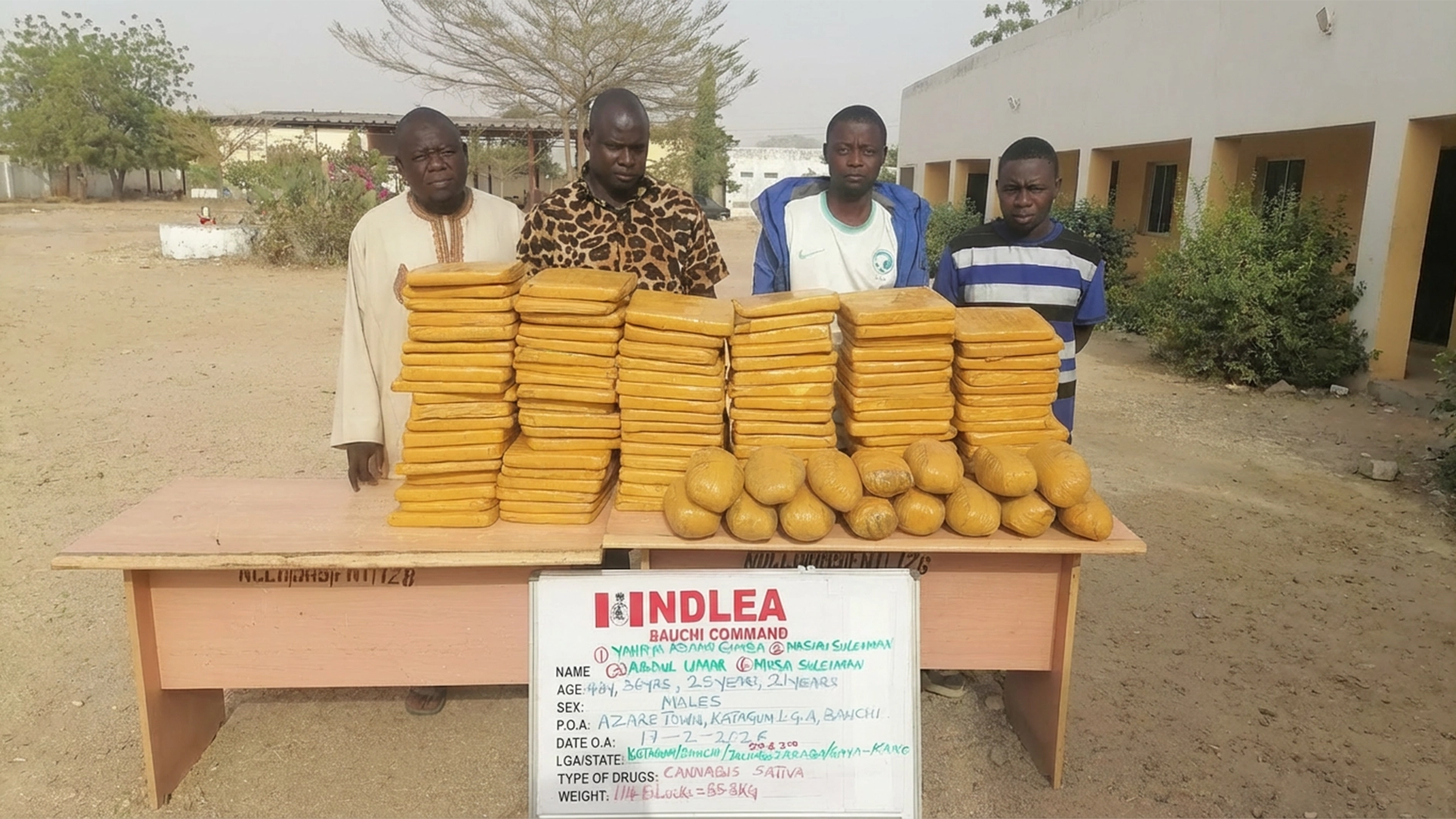 Suspects with seized items.