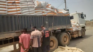 Suspects with recovered goods