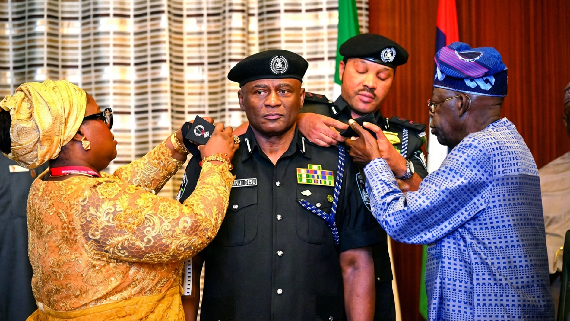 President Bola Tinubu (right); Acting Inspector General of Police (IGP), Olatunji Disu and his wife, Olufunmilola, during the decoration of the new police boss at the Presidential Villa, Abuja, yesterday.