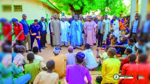 Sokoto State Governor, Ahmed Aliyu (in blue babariga with blue cap to match) and other officials at one of the feeding centres.