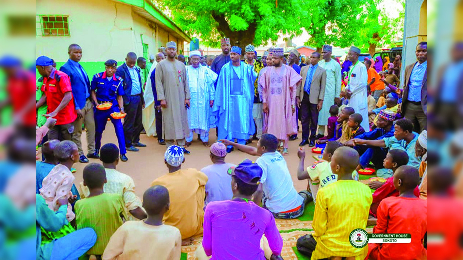 Sokoto State Governor, Ahmed Aliyu (in blue babariga with blue cap to match) and other officials at one of the feeding centres.