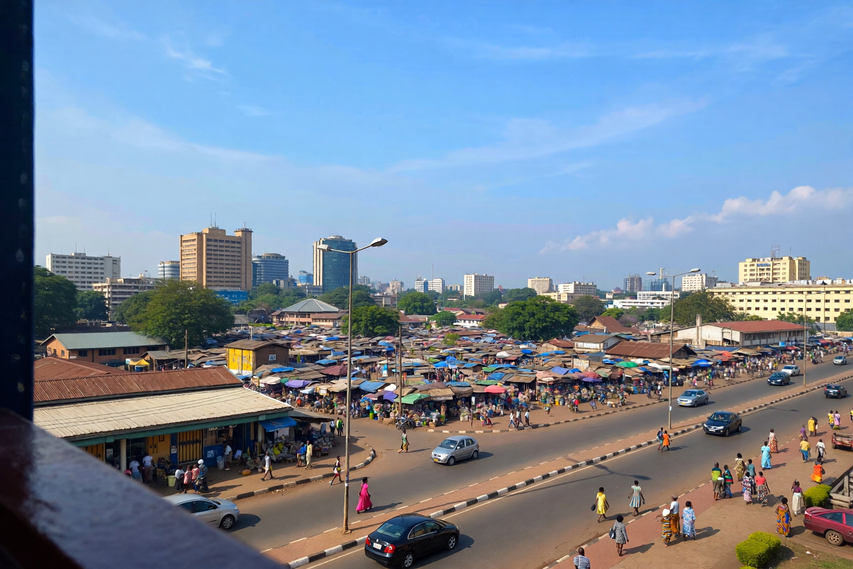 Aerial view of a Nigerian rural market and highway infrastructure illustrating regional development across Nigeria’s 36 states