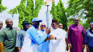 Deputy Governor, Delta State, Monday Onyeme, receives Niger Delta Games Torch from the Chairman, Delta Sports Commission Onoriode Oborevwori yesterday in Asaba