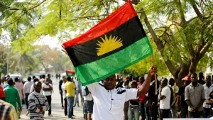 A supporter of Indigenous People of Biafra (IPOB) leader Nnamdi Kanu holds a Biafra flag during a rally in support of Kanu,