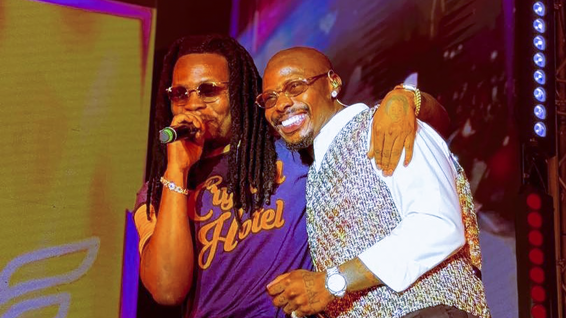 Asake and Olamide perform together on stage