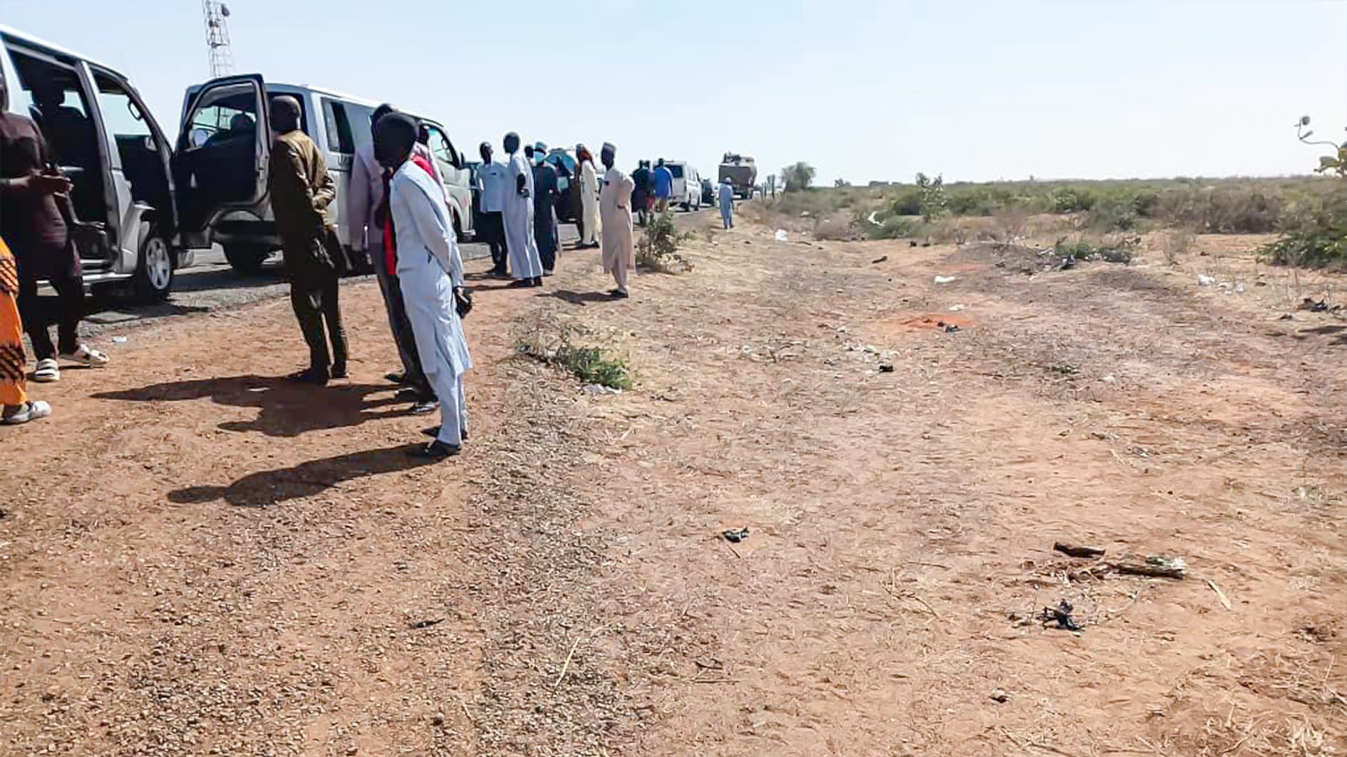 Commuters and motorist standing by borno, yobe highway