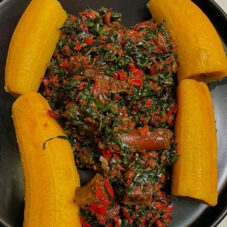 Soft boiled plantain with leafy vegetable sauce