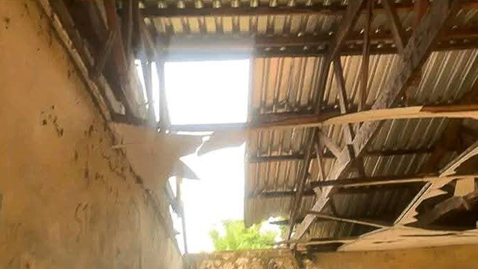 The leaking roof of one of the school buildings