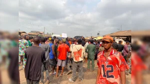 Youths blocking the road yesterday.