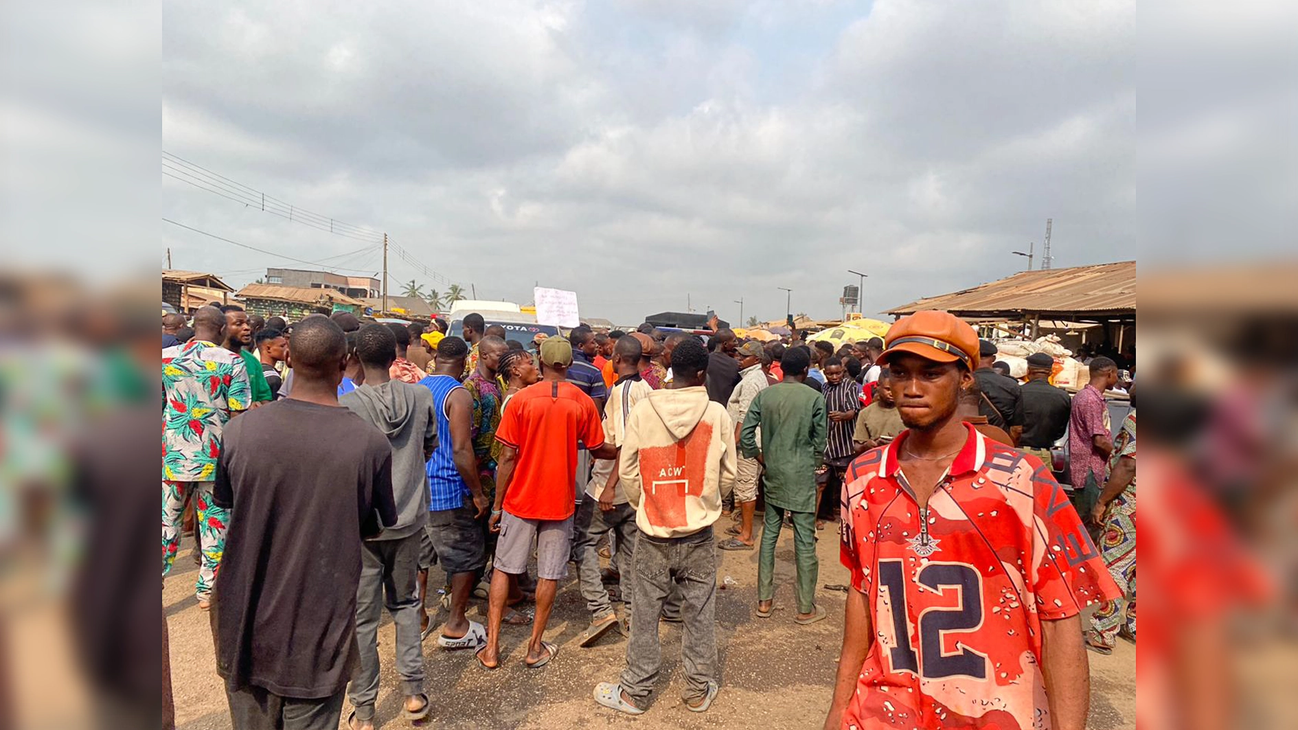 Youths blocking the road yesterday.