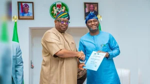 Plateau State Governor, Caleb Mutfwang (left), and Managing Director/Chief Executive Officer, Bank of Industry (BoI), Dr Olasupo Olusi at the Memorandum of Understanding (MoU) signing ceremony for a N4 billion BoI-PLSG matching fund to boost Micro, Small, and Medium Enterprises (MSMEs) in the state.