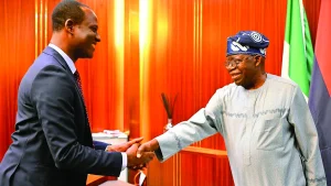 President Bola Tinubu (right) congratulating the newly sworn in Minister of State for Finance, Taiwo Oyedele, at the Presidential Villa, Abuja, yesterday.