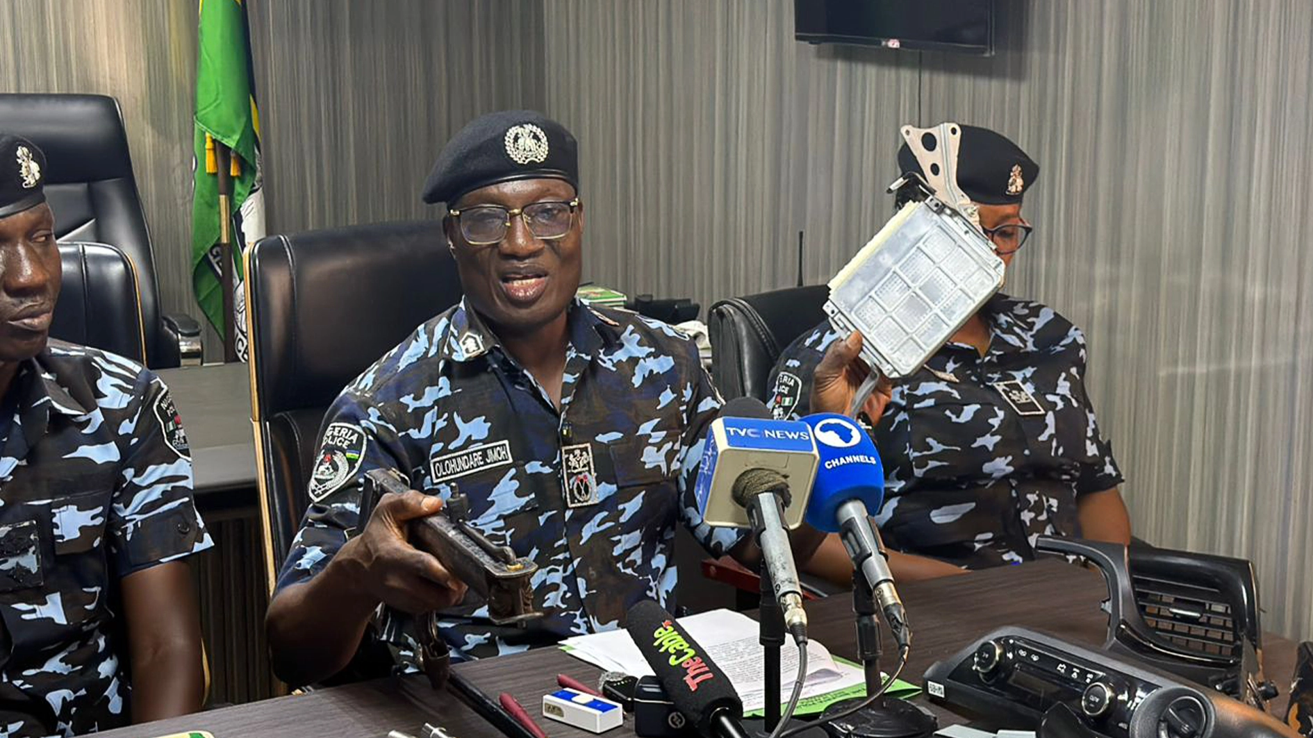 AIG Jimoh displaying some of the recovered parts          PHOTO: ENIOLA DANIEL