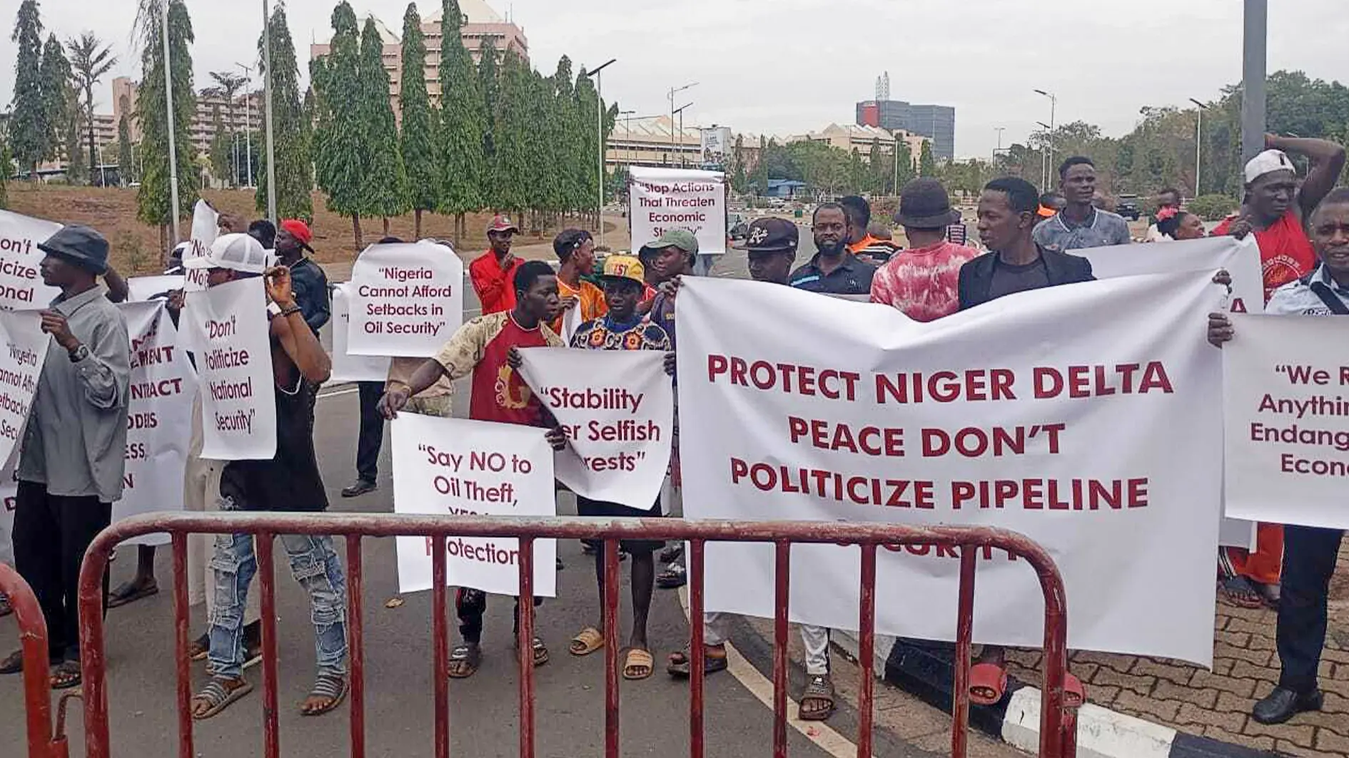 Protesters stormed National Assembly opposing decentralisation of Tantita pipeline surveillance contract, warning against reversing Niger Delta security gains efforts continue.