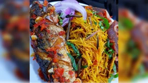 grilled-fish-spicy-sauce-vegetable-noodles-nigerian-meal.jpg